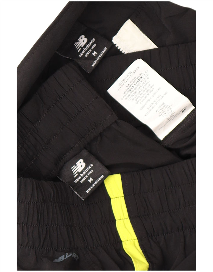 New Balance Herren-Trainingsanzug mit Grafik, mittelschwarz, Farbblock-Polyester