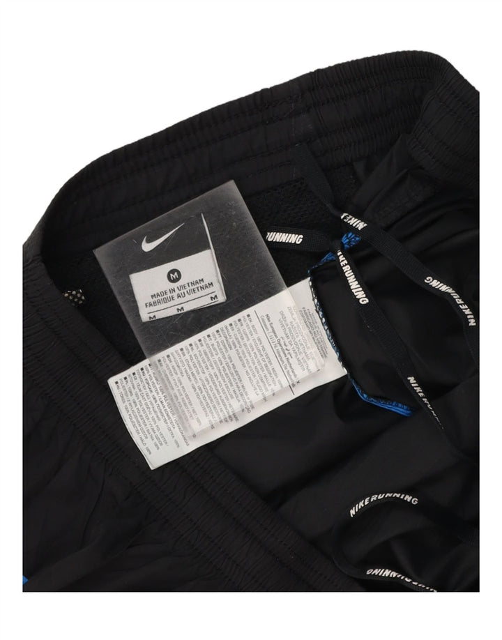 NIKE Mens Tracksuit Trousers Medium  Black Colourblock Polyester Vintage Nike and Second-Hand Nike from Messina Hembry 