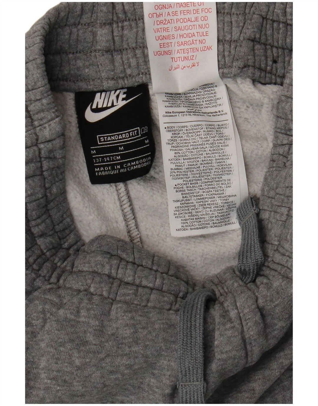 NIKE Boys Standard Fit Tracksuit Trousers Joggers 10-11 Years Medium Grey