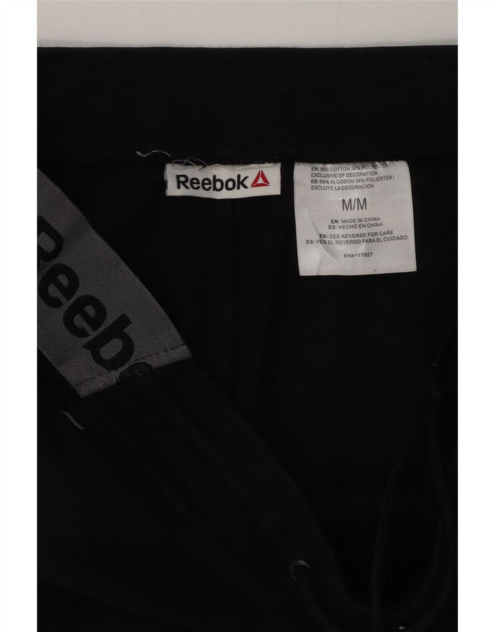 REEBOK Herren-Trainingsanzug mit Grafik, Jogginghose, Mittelschwarz, Farbblock