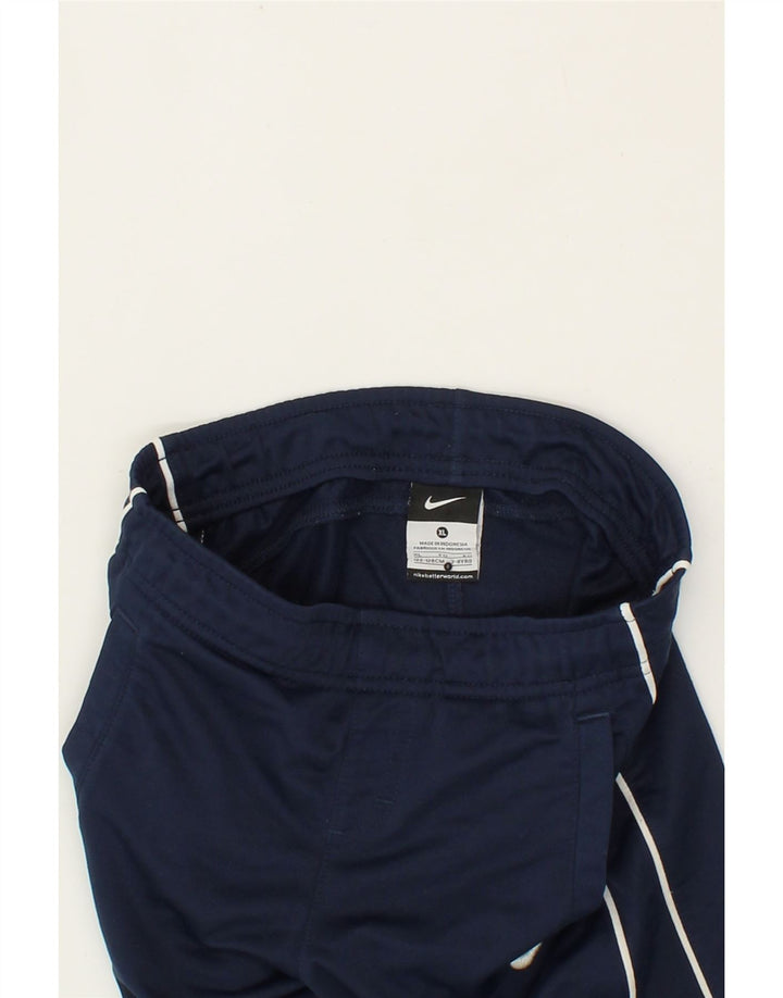 NIKE Boys Tracksuit Trousers 7-8 Years XL Navy Blue Polyester Vintage Nike and Second-Hand Nike from Messina Hembry 