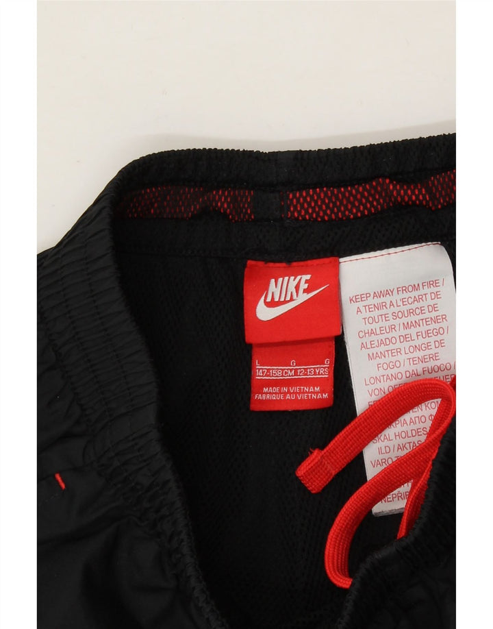 NIKE Boys Tracksuit Trousers Joggers 12-13 Years Large  Black Polyester Vintage Nike and Second-Hand Nike from Messina Hembry 