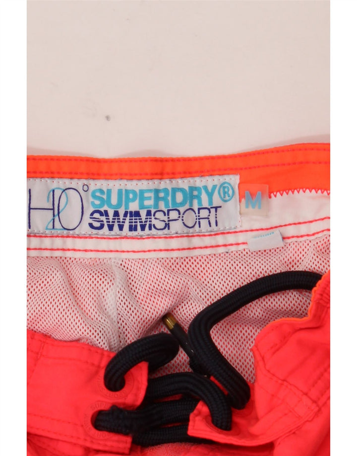 SUPERDRY Herren-Badeshorts mit Grafik, mittelorangefarbenes Polyester