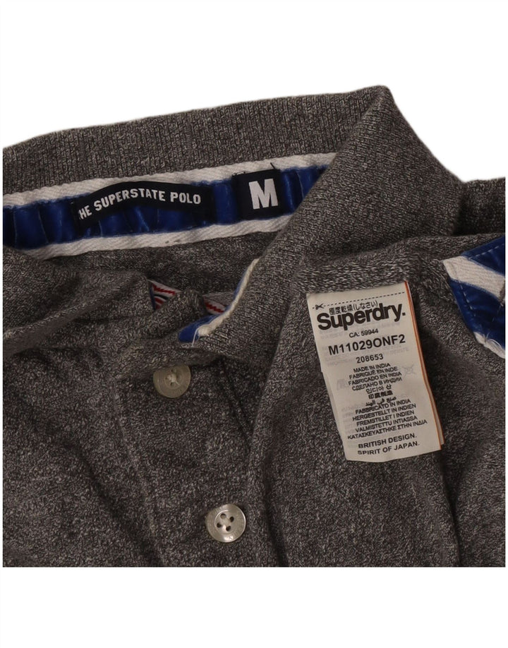 Superdry Herren-Poloshirt aus mittelgrauer Baumwolle mit Grafik