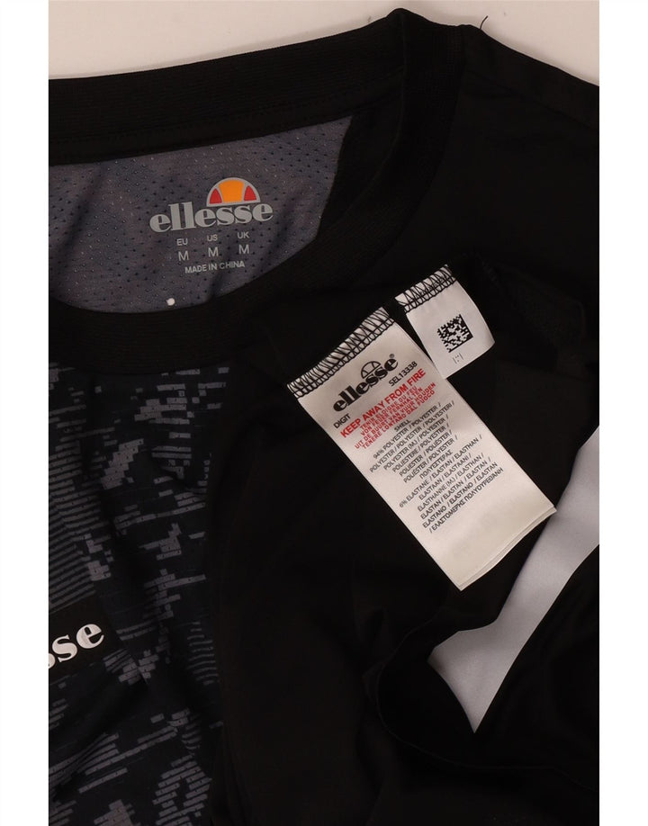 Ellesse Herren Grafik-T-Shirt-Oberteil Mittelschwarzes Patchwork-Polyester