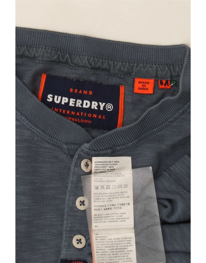 Superdry Herren-Langarmoberteil aus mittelblau gefleckter Baumwolle