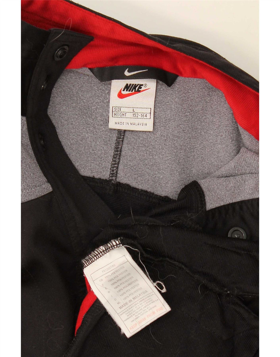 Nike Jungen-Trainingsanzug mit grafischem Oberteil, 12–13 Jahre, Größe L, Schwarz, Farbblock