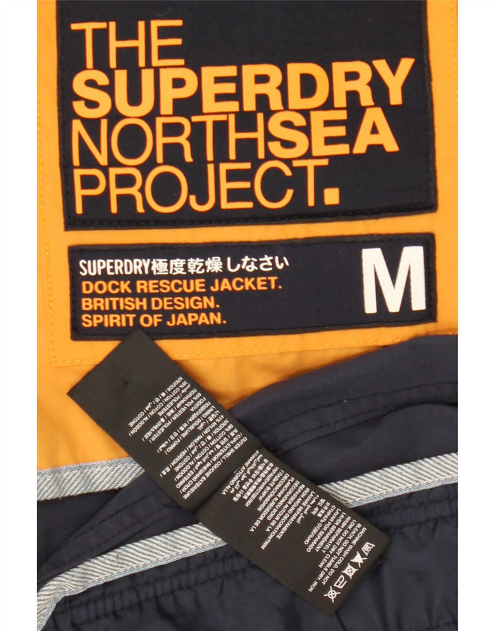 Superdry Herren-Windbreakerjacke mit Kapuze, UK 38, mittleres Marineblau, Farbblock