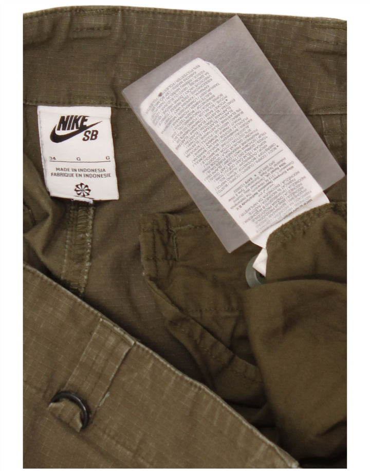NIKE Damen gerade Cargohose W34 L27 Khaki Baumwolle