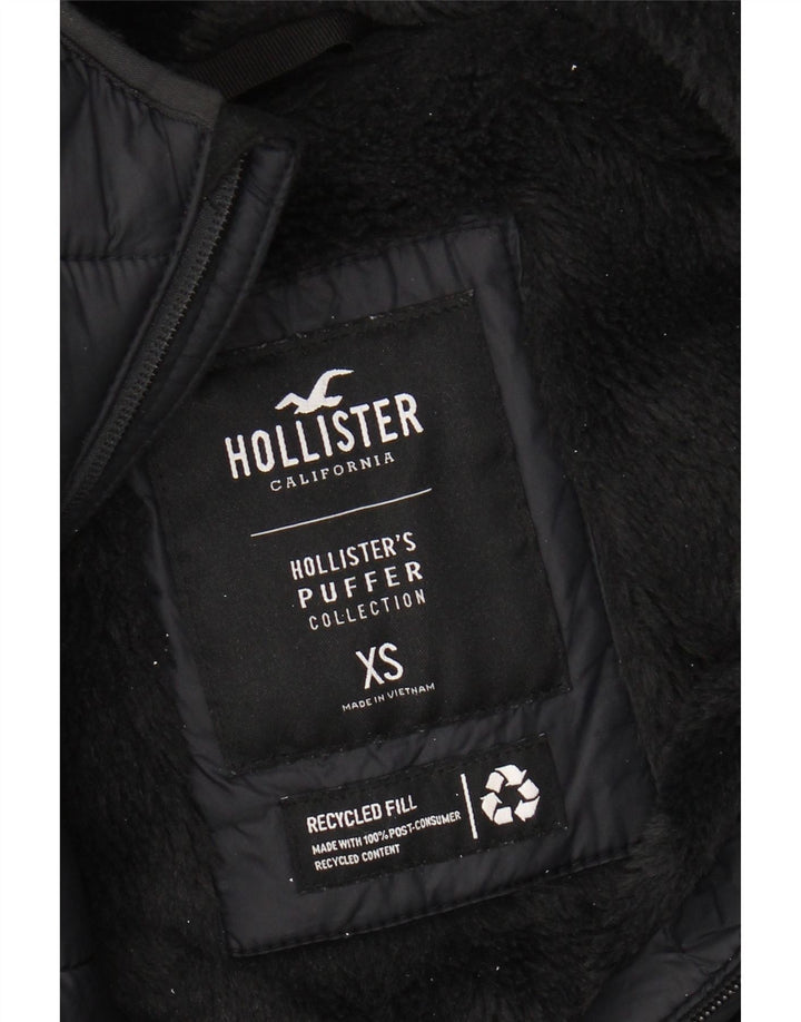 HOLLISTER Wattierte Herrenjacke mit Kapuze, UK 34 XS, schwarzes Nylon