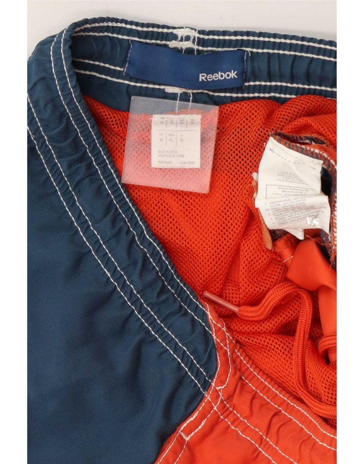 Reebok Herren-Badeshorts mit Grafik, mittelorangefarbenes Farbblock-Polyester