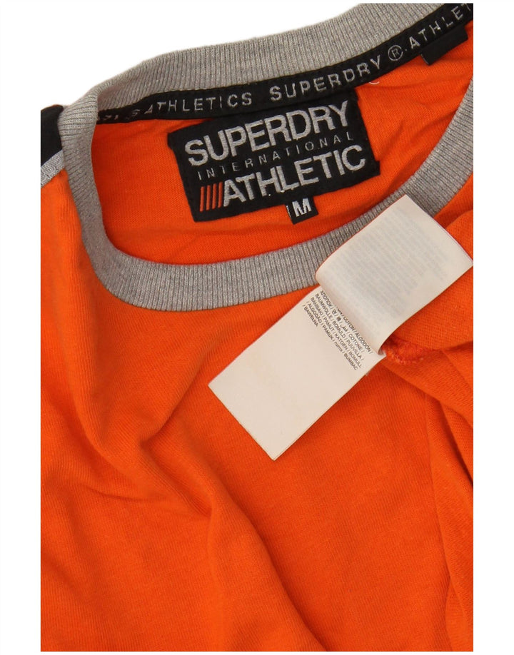 SUPERDRY Herren Grafik-T-Shirt-Oberteil aus mittelorangefarbener Colourblock-Baumwolle