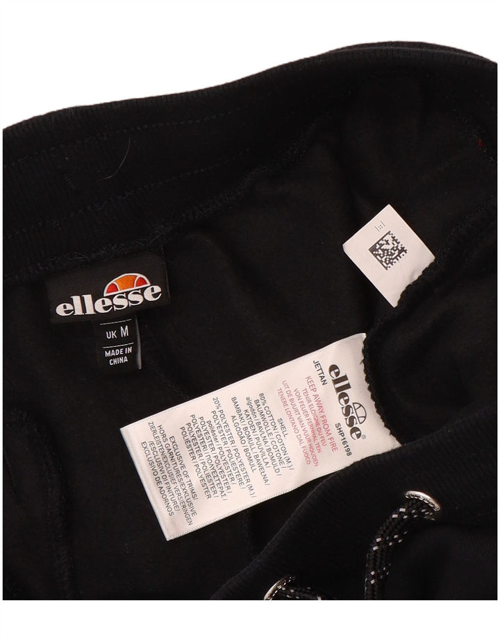 Ellesse Herren-Trainingsanzughose mit Grafik, mittelschwarz, Baumwolle