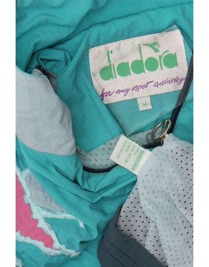 DIADORA Herren-Trainingsanzugoberteil mit lockerer Passform, mittelblaues Colourblock-Nylon