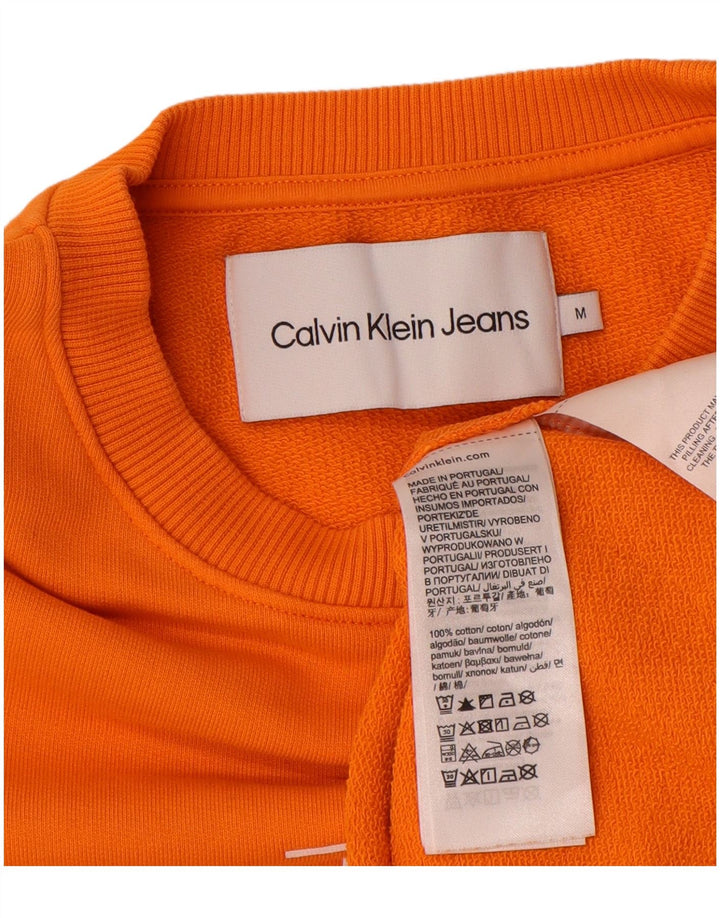 Calvin Klein Jeans Herren Grafik-Sweatshirt-Pullover aus mitteloranger Baumwolle