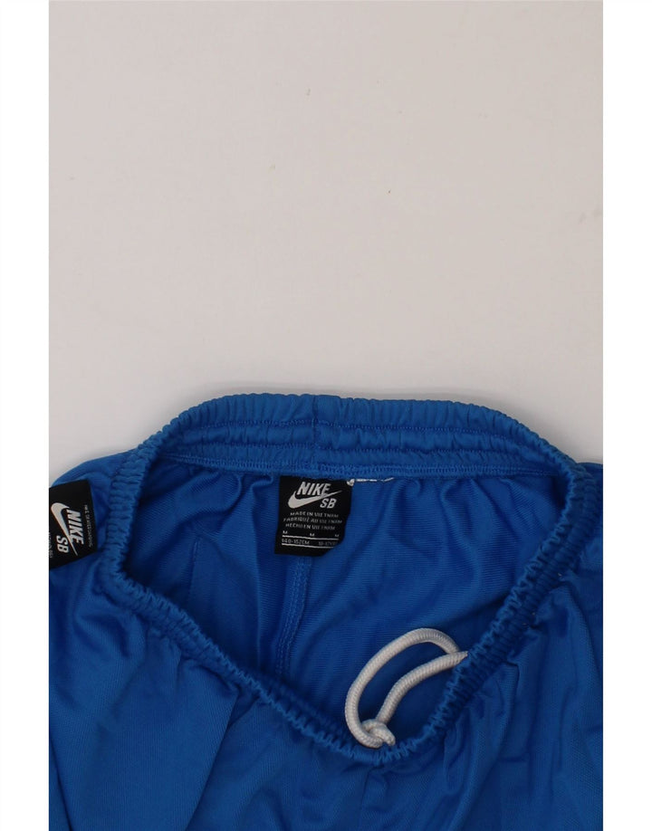 NIKE Boys Graphic Sport Shorts 10-11 Years Medium Blue Polyester Vintage Nike and Second-Hand Nike from Messina Hembry 