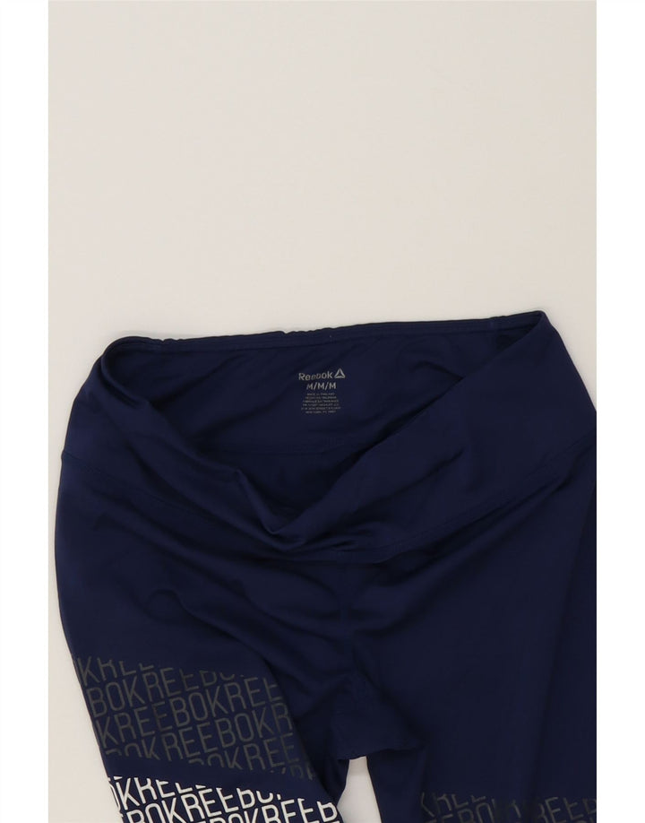 REEBOK Womens Graphic Leggings UK 14 Medium  Navy Blue Polyester Vintage Reebok and Second-Hand Reebok from Messina Hembry 