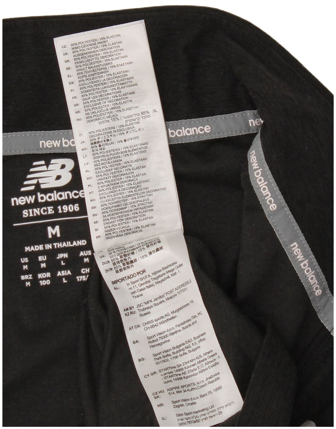 New Balance Herren-Pullover-Trainingsanzugoberteil mit Reißverschluss und Halsausschnitt, Mittelschwarz gefleckt