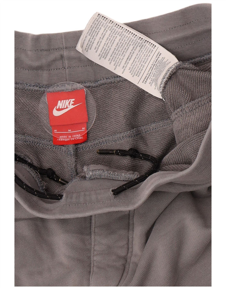 Nike Herren-Trainingshose mit Grafik, mittelgrau, Farbblock