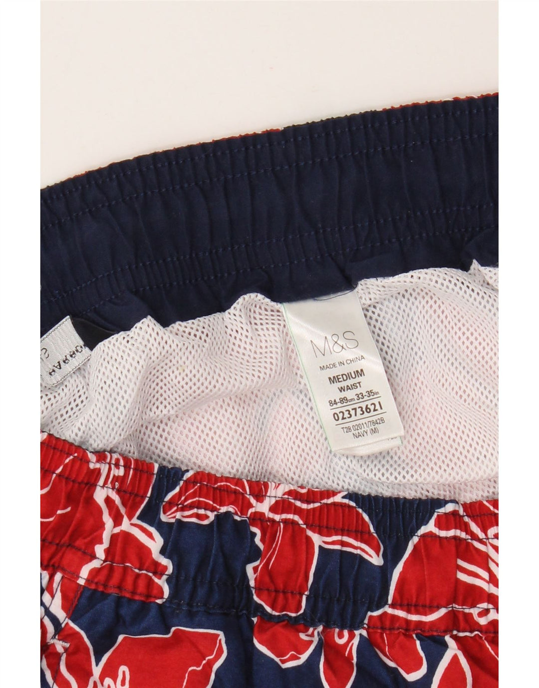 Marks & Spencer Herren-Badeshorts aus Polyester in mittlerem Marineblau mit Blumenmuster