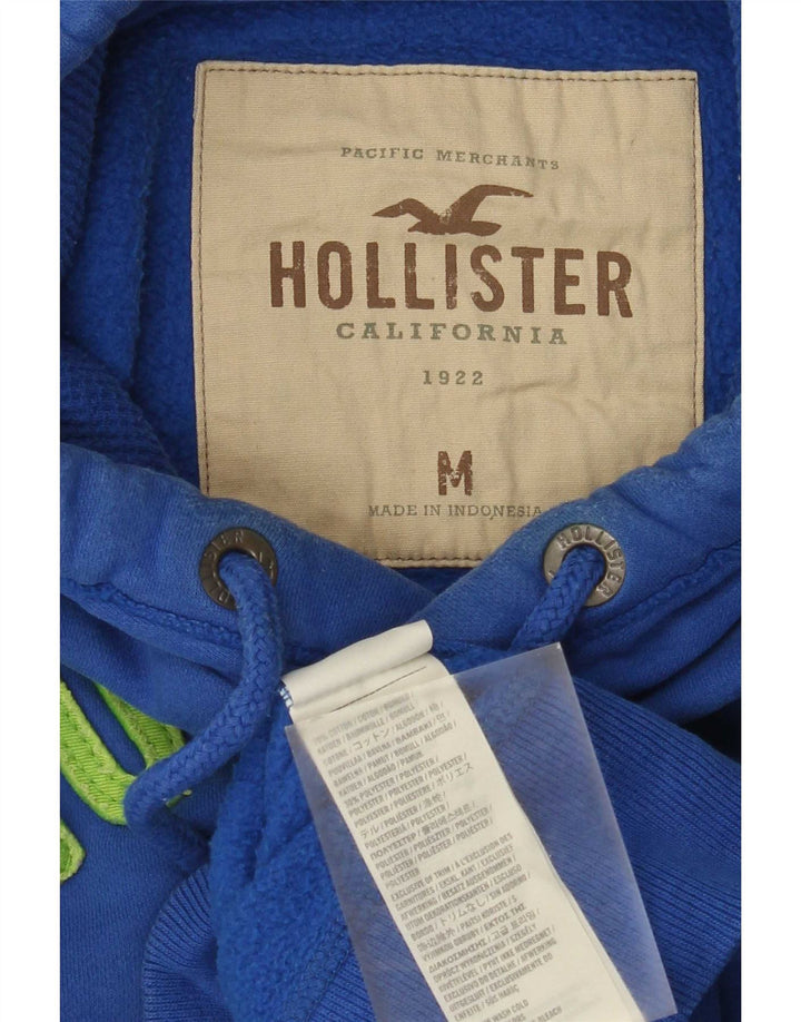 Hollister Herren-Kapuzenpullover mit Grafik, mittelblaue Baumwolle