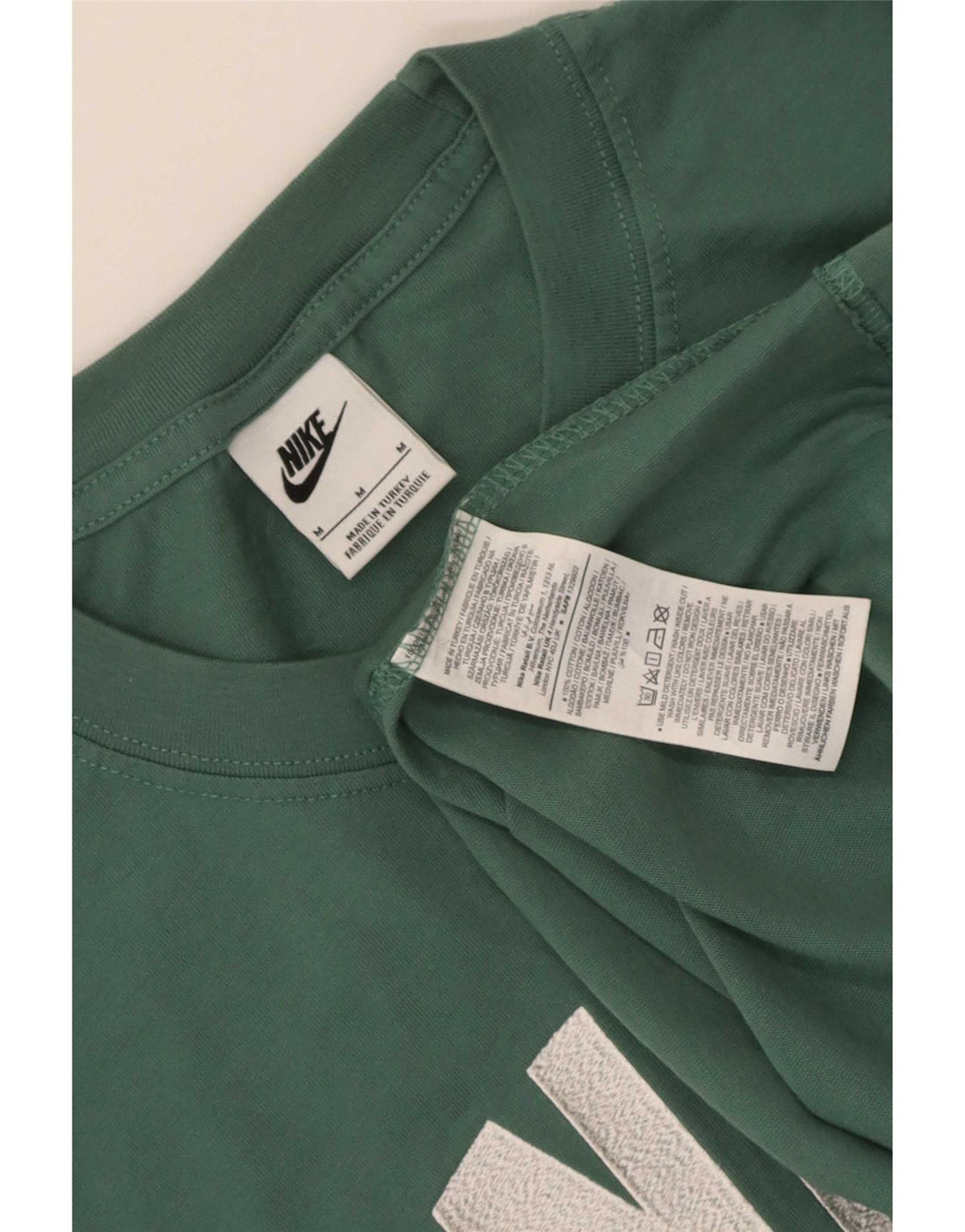 Nike Herren Grafik-T-Shirt-Oberteil aus mittelgrüner Colourblock-Baumwolle
