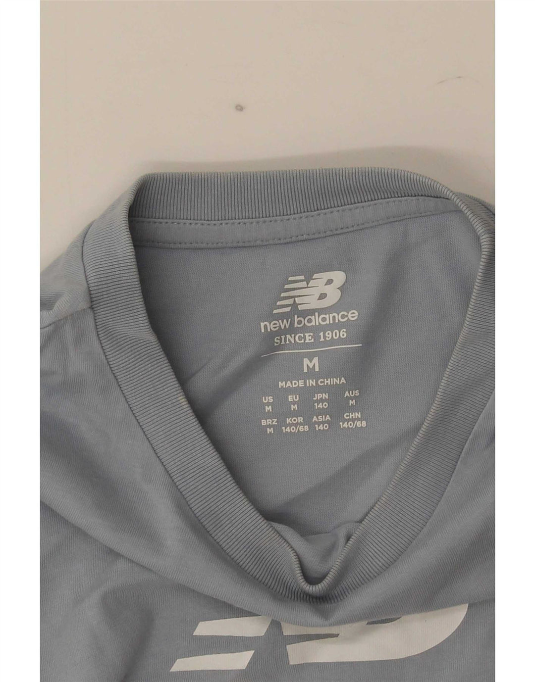 New Balance Jungen T-Shirt mit Grafik, 9–10 Jahre, Mittelblau
