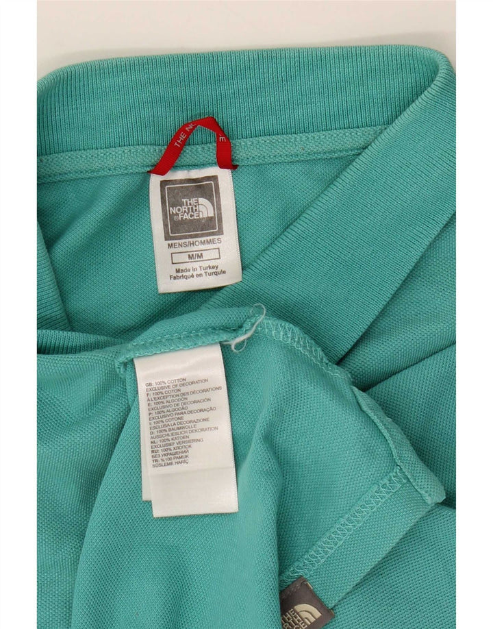 The North Face Herren-Poloshirt aus mitteltürkisfarbener Baumwolle