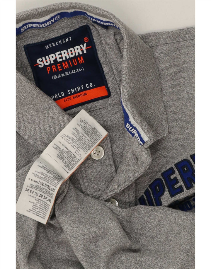 Superdry Herren-Poloshirt aus mittelgrauer Baumwolle mit Grafik
