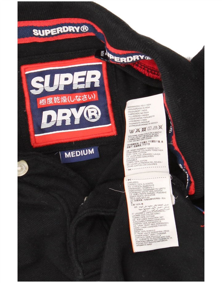 SUPERDRY Herren-Poloshirt mit grafischem Muster, Mittelschwarz, Baumwolle mit Blockfarben