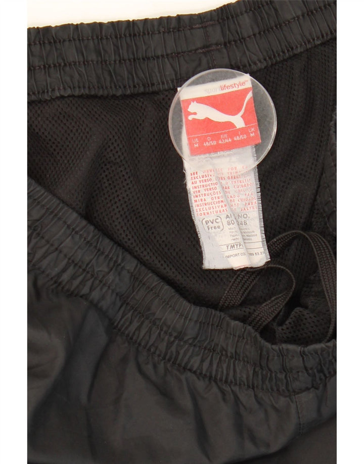 Puma Herren-Trainingshose mit Grafik, mittelschwarz, Polyamid