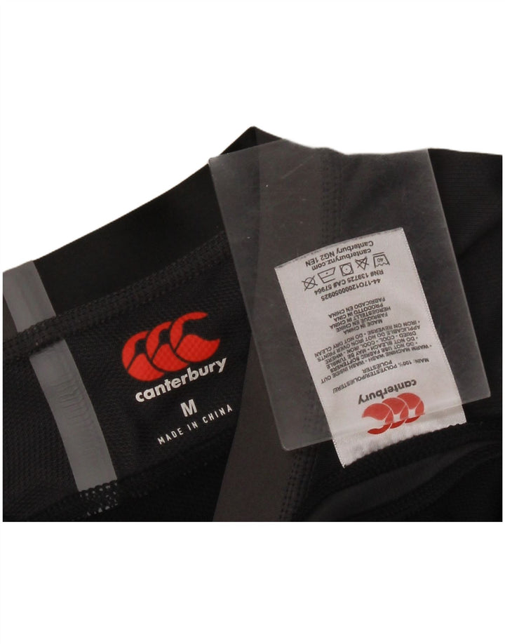 Canterbury Herren-Grafik-T-Shirt-Oberteil Mittelschwarzes Colourblock-Polyester