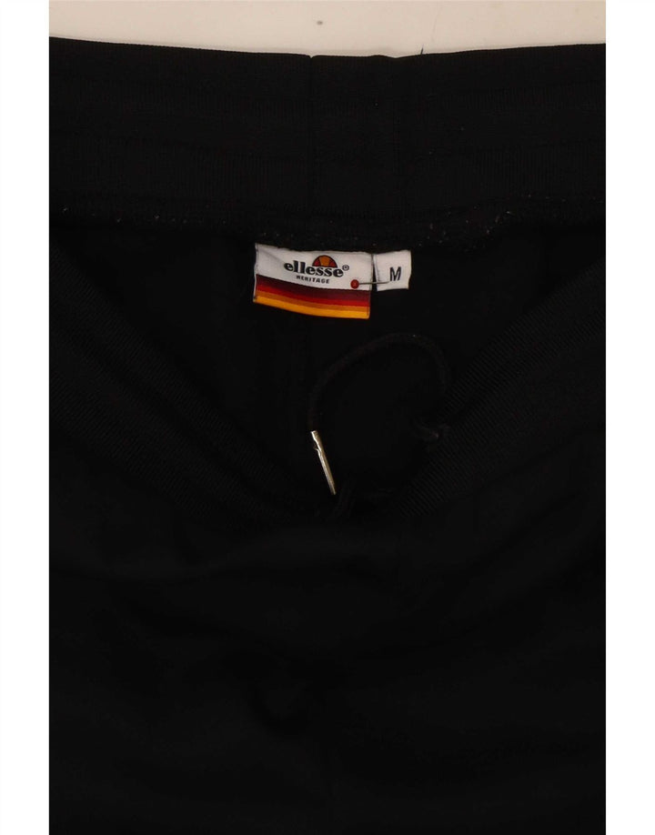Ellesse Herren-Trainingshose mit grafischem Muster, mittelschwarze Colourblock-Baumwolle