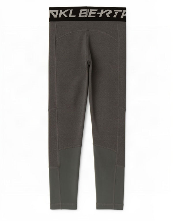 Nike Dri Fit Grafik-Leggings für Mädchen, 8–9 Jahre, Größe S, Grau, Farbblock