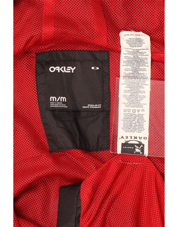 Oakley Herren-Regenjacke mit Kapuze, reguläre Passform, UK 38, mittelschwarzes Nylon