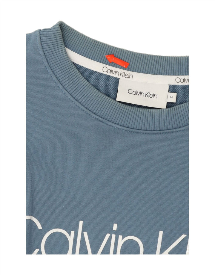CALVIN KLEIN Mens Graphic Sweatshirt Jumper Medium Blue Cotton Vintage Calvin Klein and Second-Hand Calvin Klein from Messina Hembry 