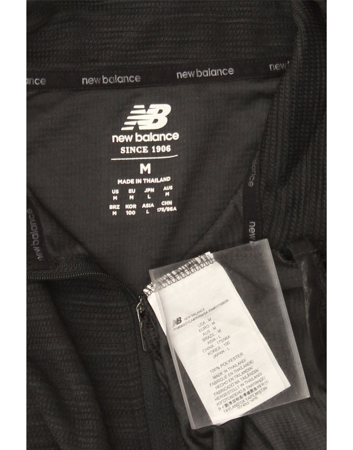 New Balance Herren-Pullover-Trainingsanzugoberteil mit Reißverschluss, Mittelschwarzes Polyester